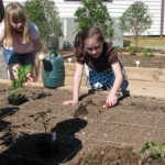 Children enjoy working in the garden.